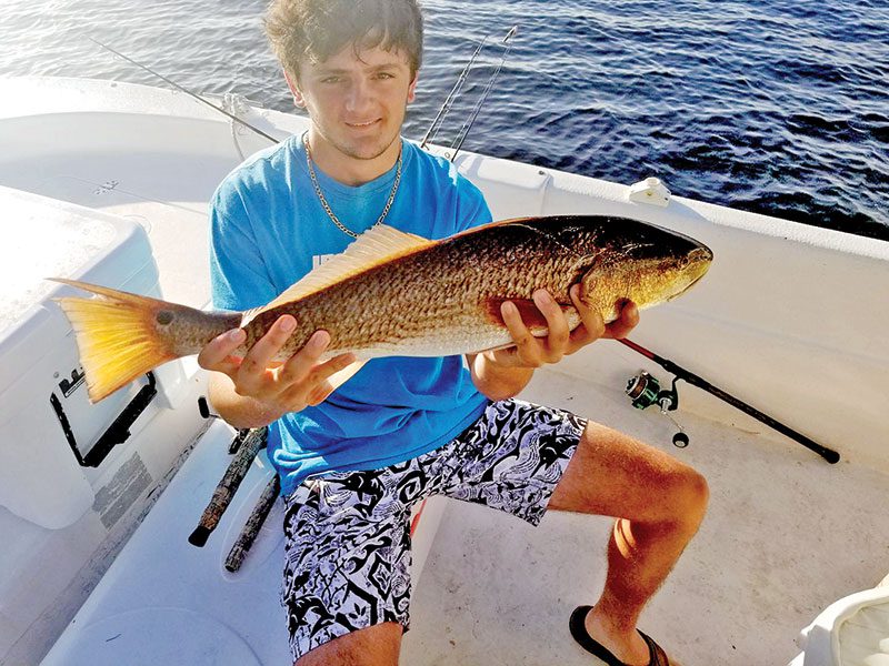 Dylan Shingler getting in some redfish action with Dad.