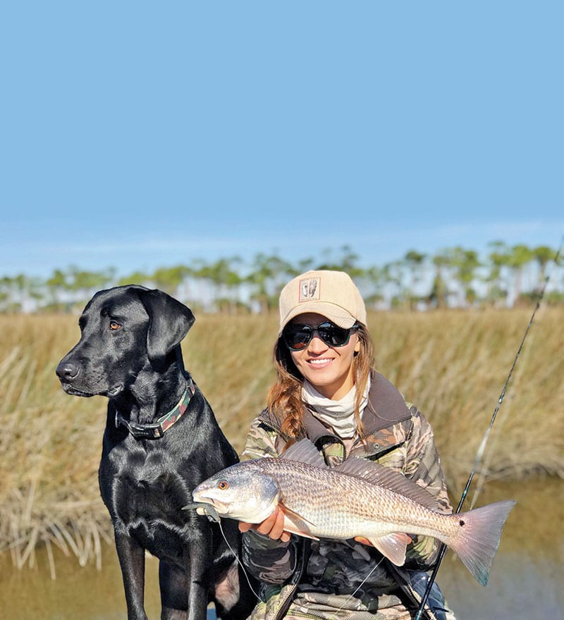 Emma Hurley with a pretty redfish she site fished along with the Murph Dog, post Hurricane Michael.