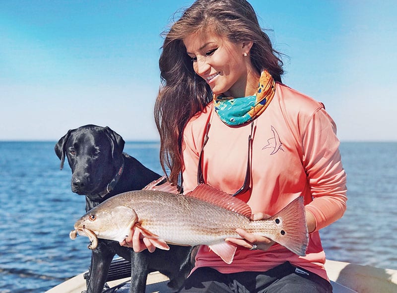 Emma Hurley with her first redfish caught on artificial while sight fishing with the Murph dog.