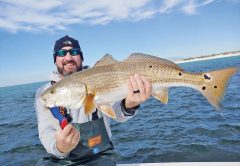 Fred Wilson with a beauty of a redfish near PCB.