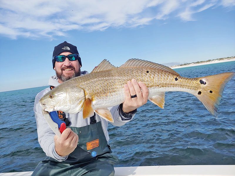 Fred Wilson with a beauty of a redfish near PCB.