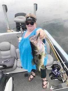 Gale Goodman, co-owner of Wingates Lunker Lodge, with a healthy Seminole bass.