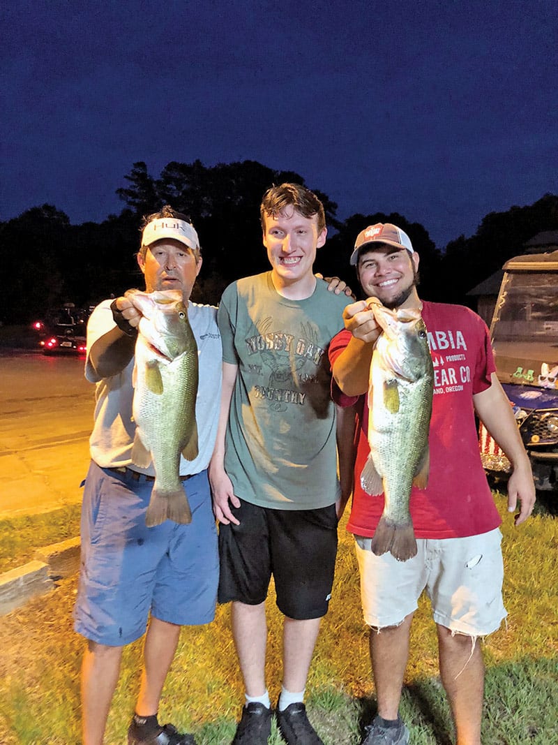 Guide Paul Tyre and Will Granger with their winning catch at a recent Thursday Night Shootout.