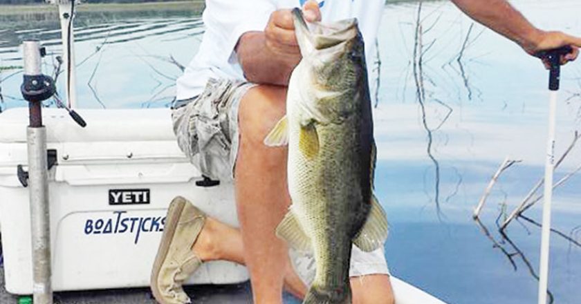 JR Munginger using his Boatstick to pin his boat and catching a nice Lake Jackson bass.