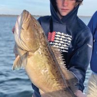 Jake Williams of Panama City with a nice bay grouper fishing with Capt Daryl, Liquid Native Charters.