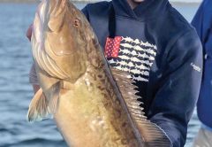 Jake Williams of Panama City with a nice bay grouper fishing with Capt Daryl, Liquid Native Charters.