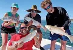 Jason, Blake, Mark, and Jennie with a quadruple header on redfish.
