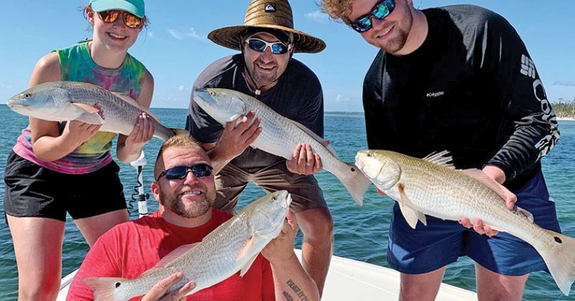 Jason, Blake, Mark, and Jennie with a quadruple header on redfish.