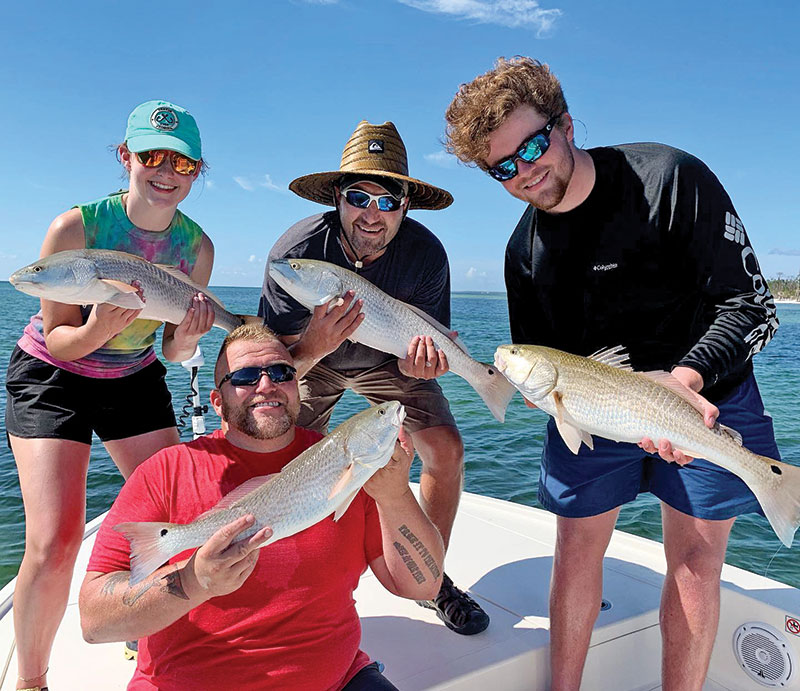 Jason, Blake, Mark, and Jennie with a quadruple header on redfish.