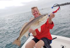 Joan traveled all the way up from Tampa to catch and release this bull red aboard the C-note boat.