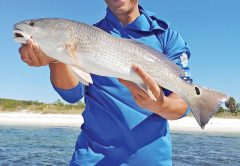 Johnny with a nice slot red aboard the C-note boat.
