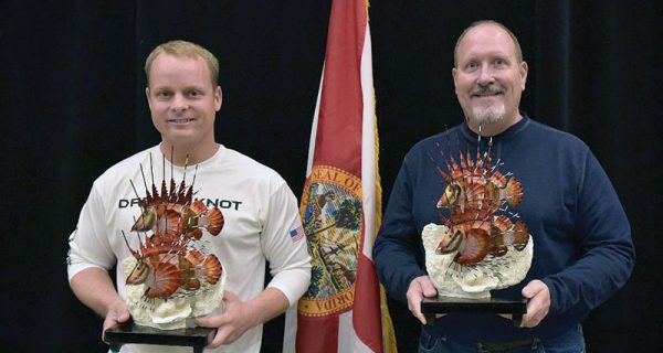 Josh Livingston and Ken Ayers pose with their trophies at a recent FWC award presentation in Panama City.