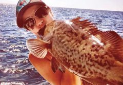 Kayla Messer smooching a gag grouper...lucky fish!