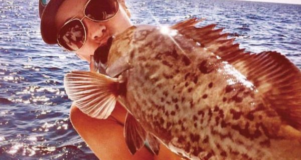 Kayla Messer smooching a gag grouper...lucky fish!