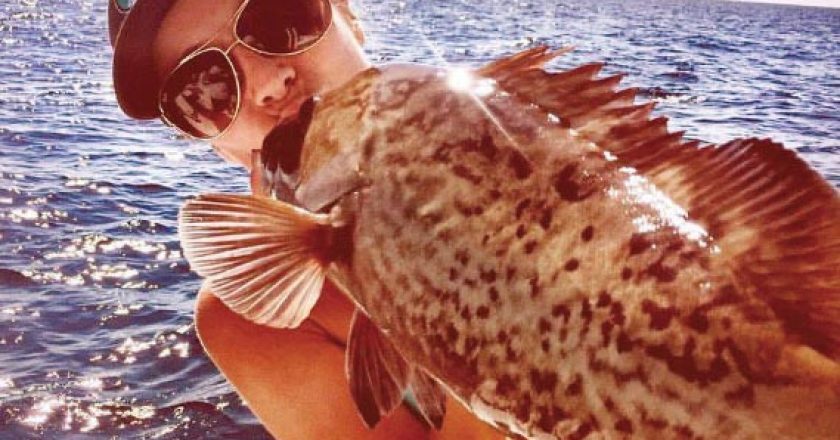 Kayla Messer smooching a gag grouper...lucky fish!