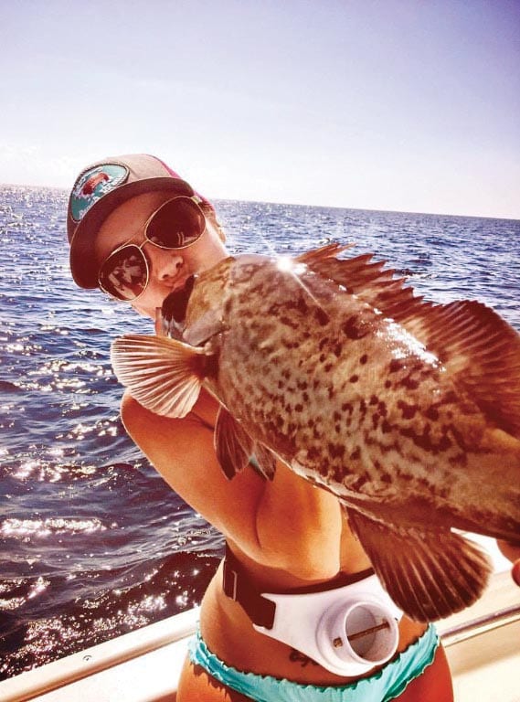 Kayla Messer smooching a gag grouper...lucky fish!