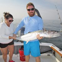 Kim and Bill Jones with a spring king aboard Natural World Charters with Capt. Chester Reese.