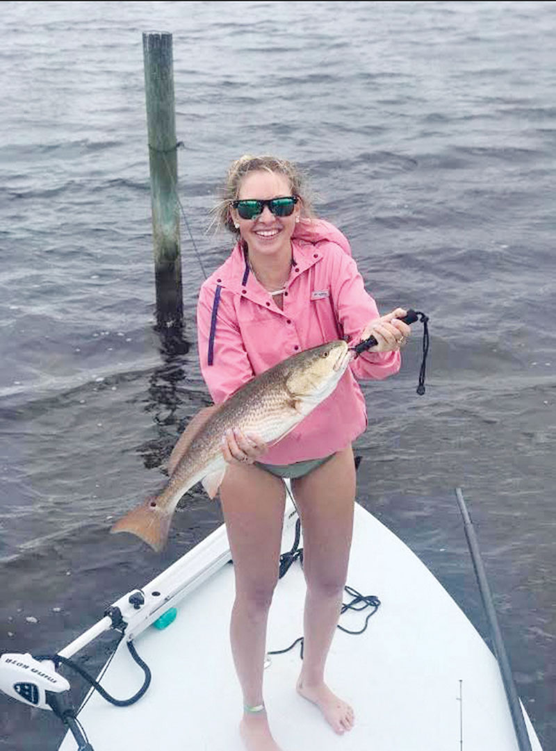 Kinzie Harrington of PC with a rainy day redfish.