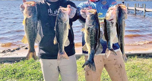 Kyle Pridgen and C-note with their 15 lb. winning bag of Deerpoint bass in the last Reel Money Team Trail event.