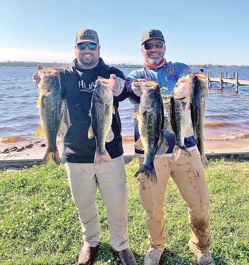 Kyle Pridgen and C-note with their 15 lb. winning bag of Deerpoint bass in the last Reel Money Team Trail event.