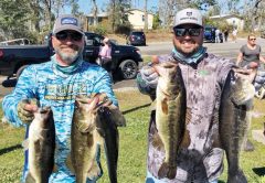 Kyle Pridgen and C-note with their winning 14 lb. bag of Deerpoint bass.