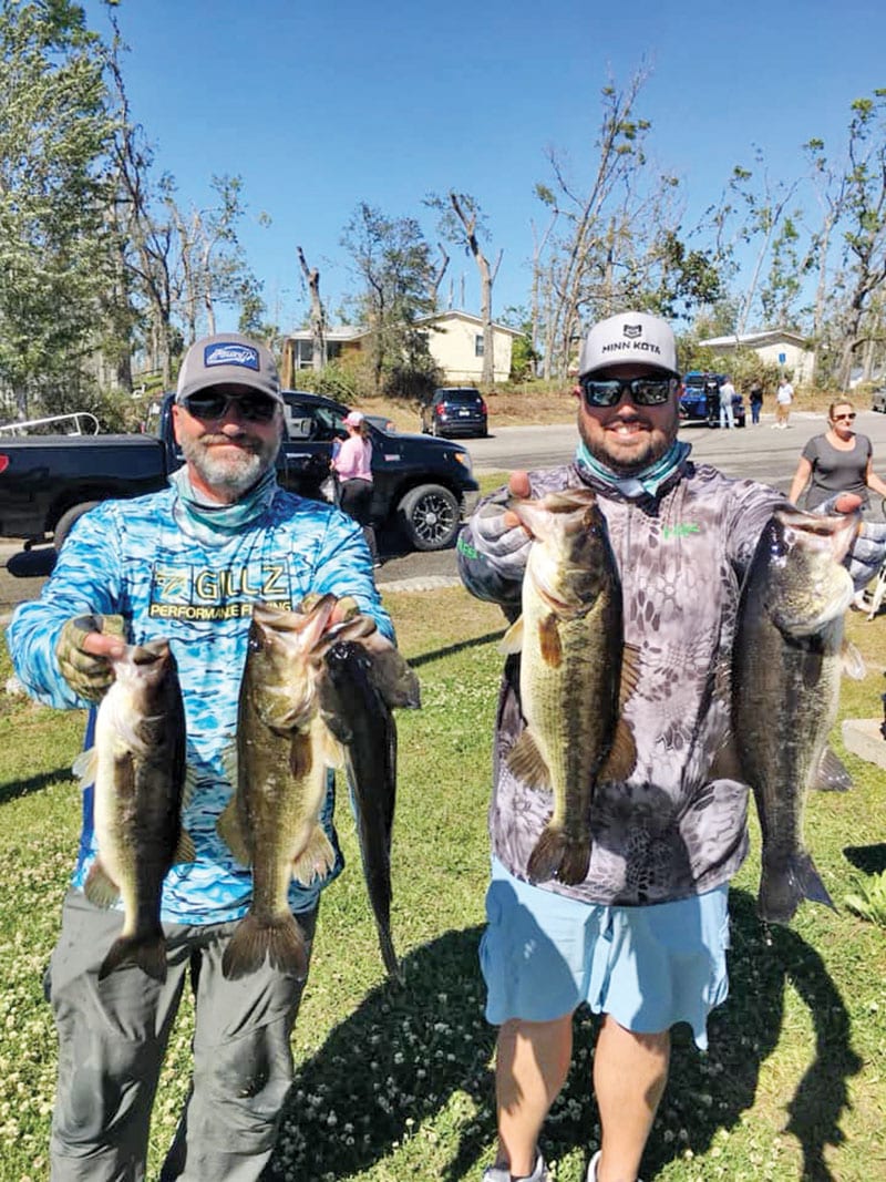 Kyle Pridgen and C-note with their winning 14 lb. bag of Deerpoint bass.