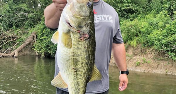 Kyle Pridgen with a giant 9 lb. bass he caught on the Apalacchicola River. A rare find on this river.