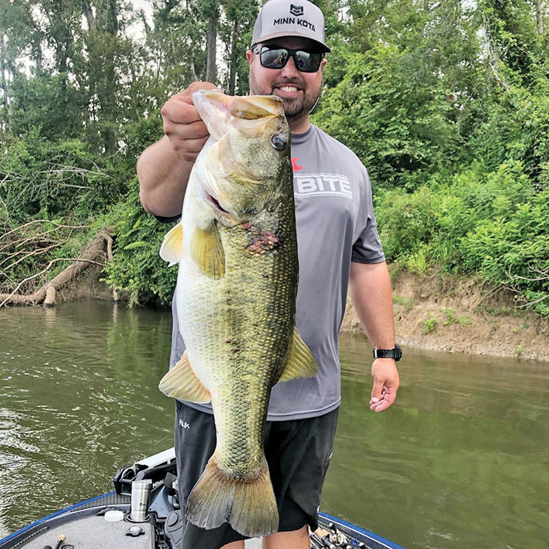 Kyle Pridgen with a giant 9 lb. bass he caught on the Apalacchicola River. A rare find on this river.
