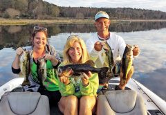 Lara Madeline, Julie Happersett & Eric Norberg holding some nice Lake Jackson bass from their day on the water with guide JR Mundinger.