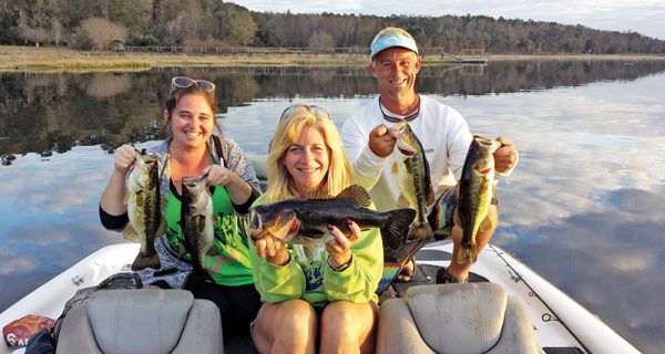 Lara Madeline, Julie Happersett & Eric Norberg holding some nice Lake Jackson bass from their day on the water with guide JR Mundinger.