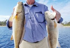 Larry Martin having some redfishing fun with Capt. Jason.