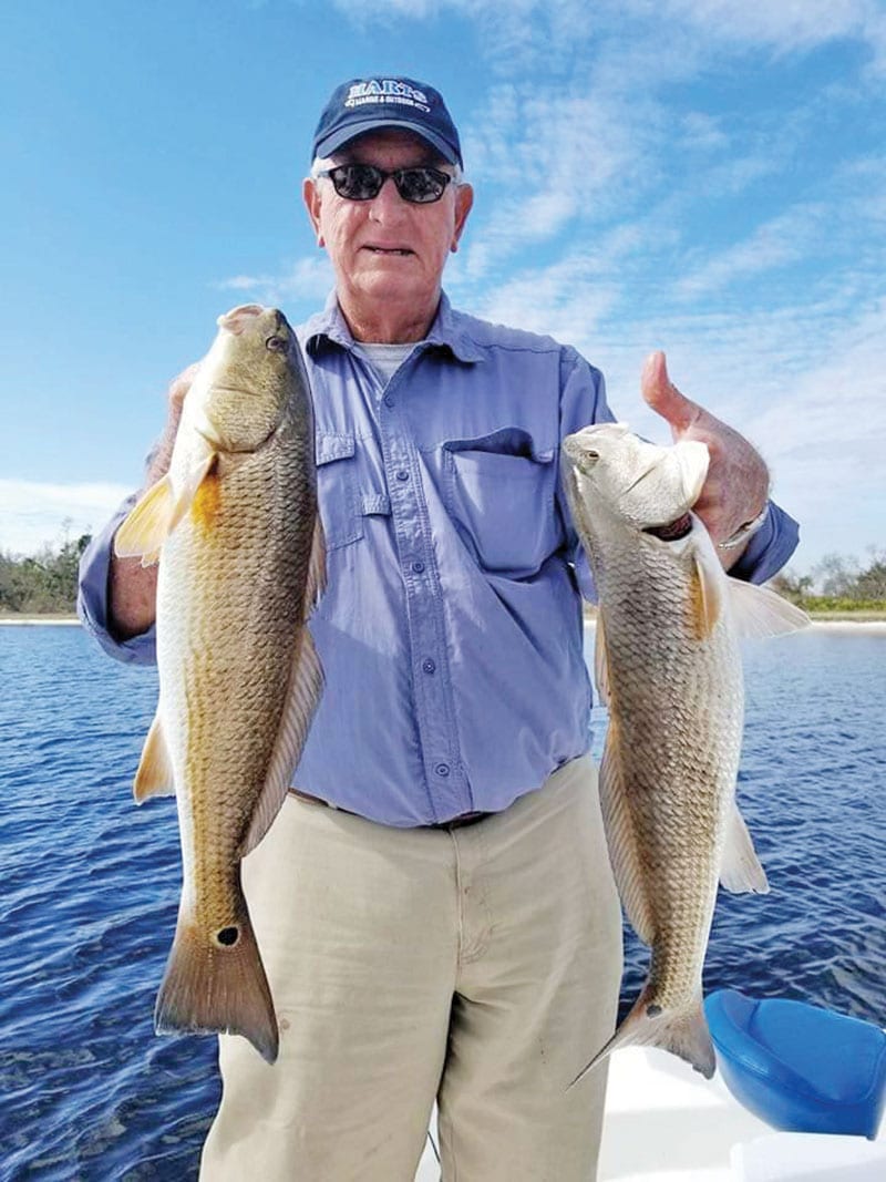 Larry Martin having some redfishing fun with Capt. Jason.