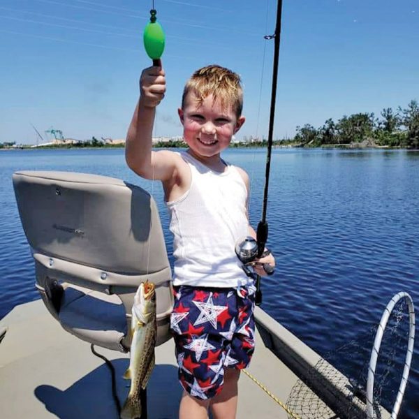 Layton Hall-Resnikoff hauling in some bay trout.