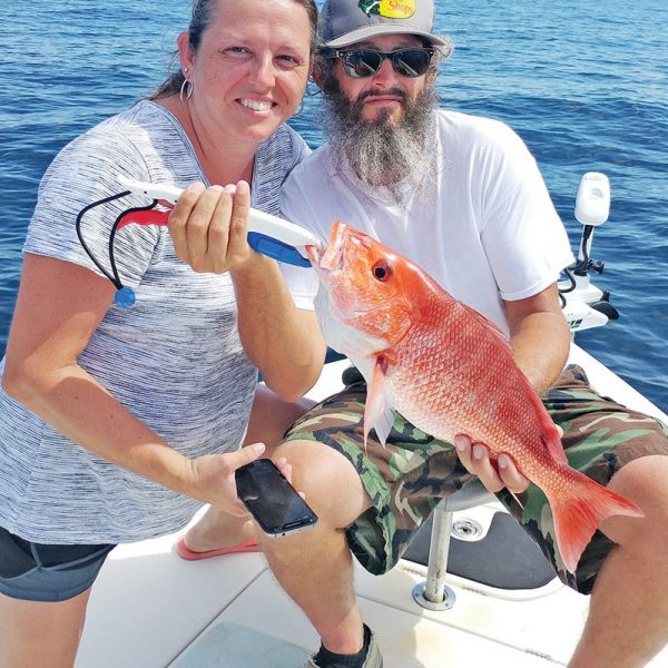 Mary & Justin aboard the C-note boat haulin snapper.