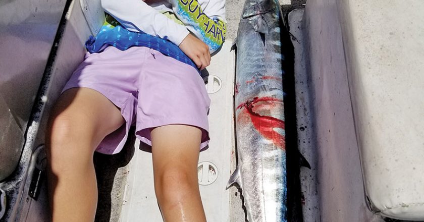 Matthew Tew with a 55 inch wahoo caught 35 miles offshore.