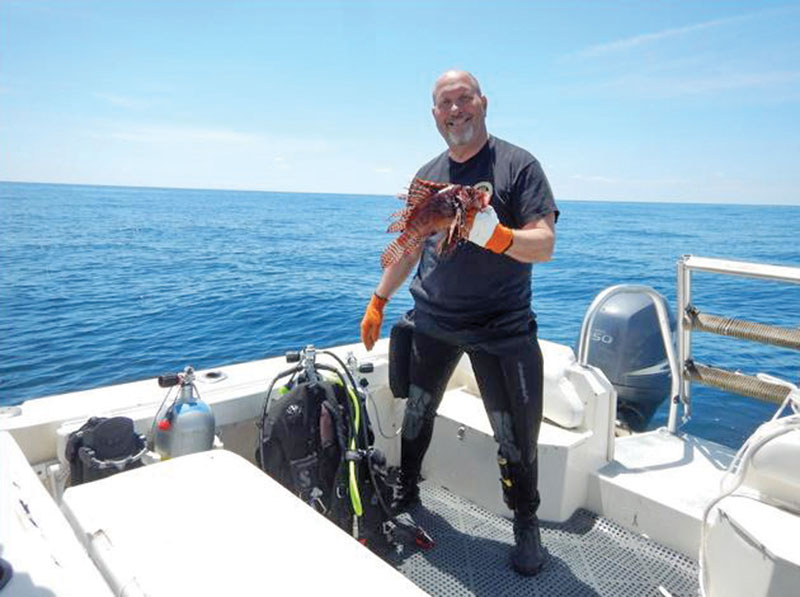 Ken with one of many of the very large lionfish he bagged.