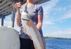 Michele Olson with a respectable red caught with Capt. Jason.