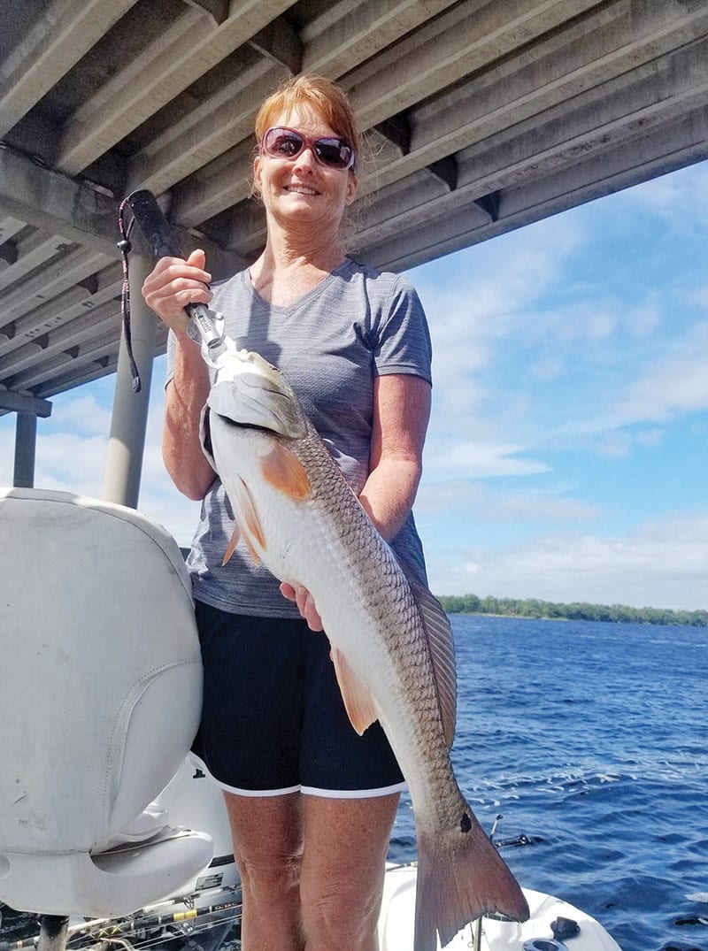 Michele Olson with a respectable red caught with Capt. Jason.