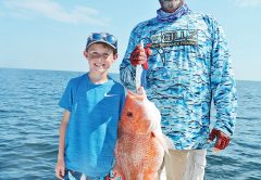 Nicholas and Capt. C-note haulin’ snapper.