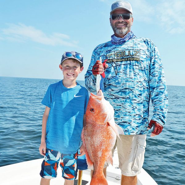 Nicholas and Capt. C-note haulin’ snapper.