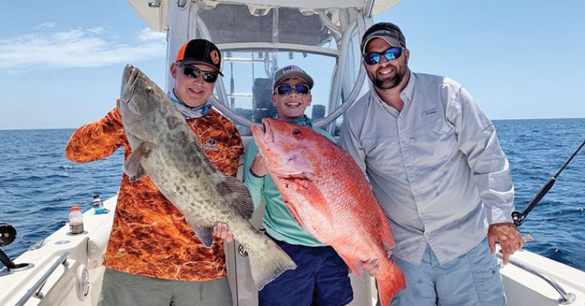 Parker Gillman, Landon Celona & Brian Beighey loading the boat.