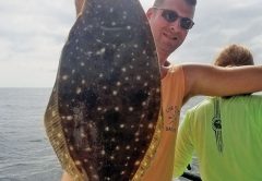 Patrick Horan with a nice 21 inch flounder fishing with Capt. Jason.