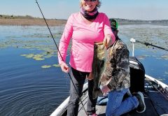 Rhonda Hastings holding up a nice 3-lber caught on another very tough windy day.