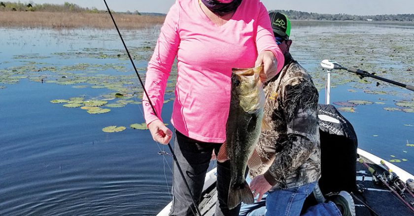Rhonda Hastings holding up a nice 3-lber caught on another very tough windy day.
