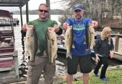 Rob Lawhon and Travis McQuaig holding up 5 beauties anchored by two 8lbers caught off beds in mid February.