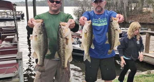 Rob Lawhon and Travis McQuaig holding up 5 beauties anchored by two 8lbers caught off beds in mid February.