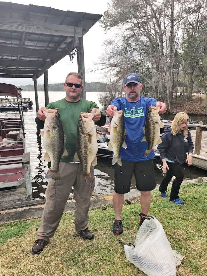 Rob Lawhon and Travis McQuaig holding up 5 beauties anchored by two 8lbers caught off beds in mid February.