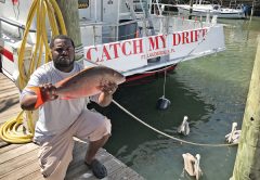 Steve from Get Some Fishing with a nice mutton he caught aboard the Catch My Drift.