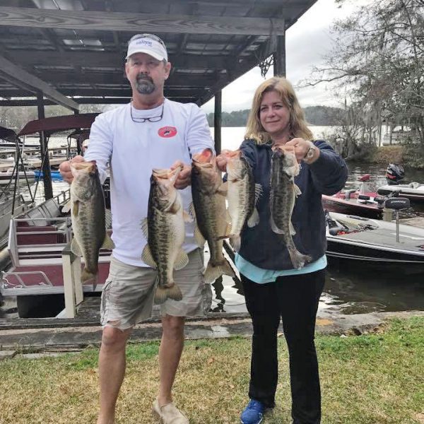 Talquin guide JR Mundinger and Julie Happersett with a nice bag of Talquin bass taken from the lily pads.