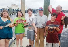 The Barnes family braved some rough seas and tough conditions with Capt. Tew aboard the Kitchen Pass but still had a great time.
